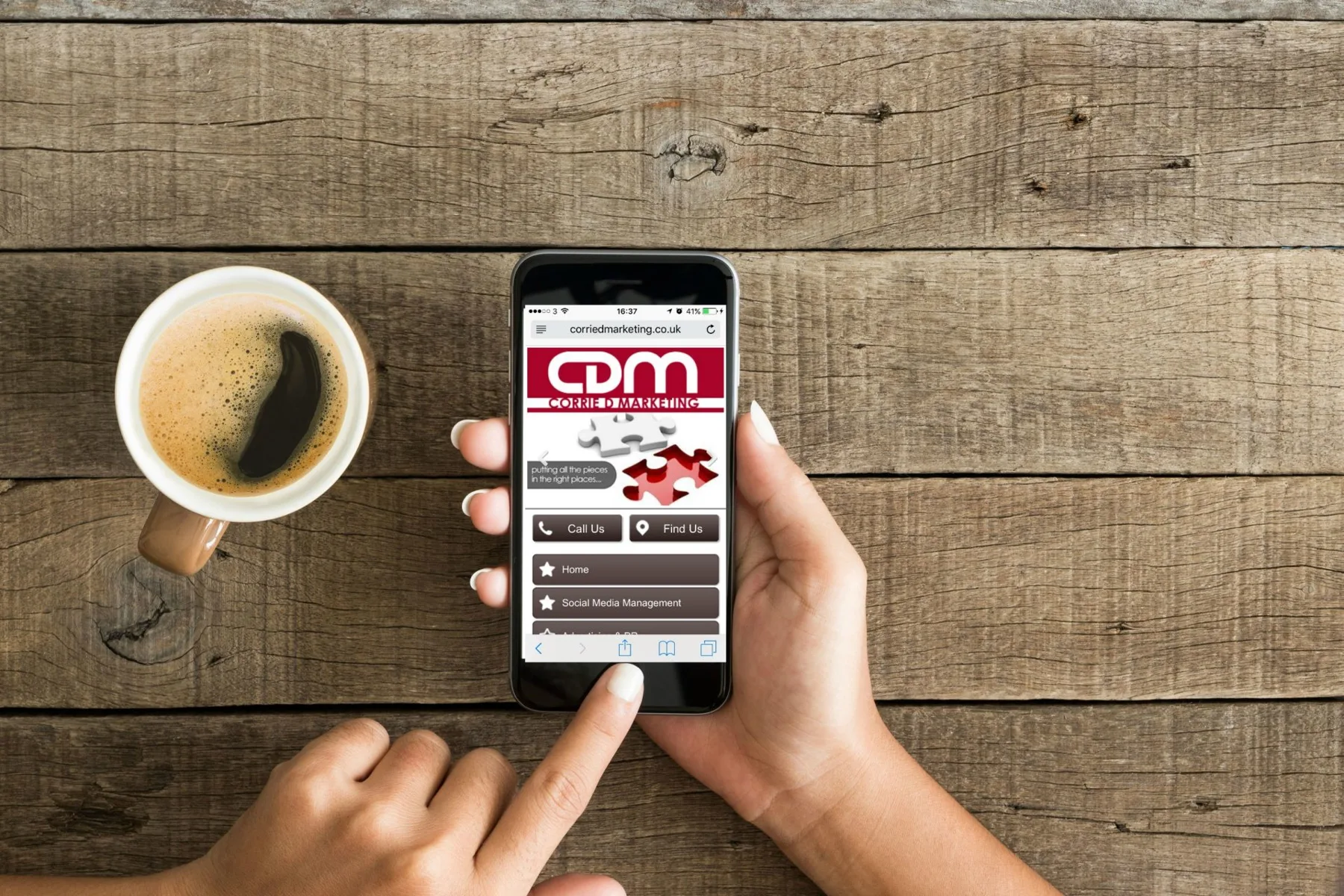 Corrie D Marketing website shown on a mobile phone